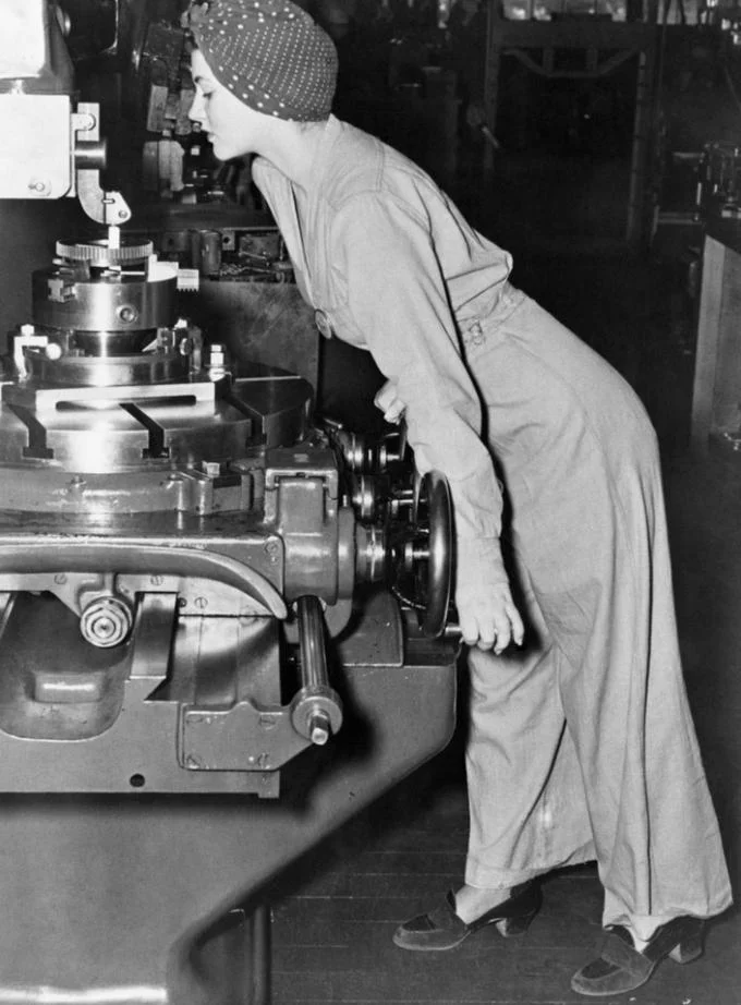 We Can Do It — Historical black and white WWII factory worker photograph.