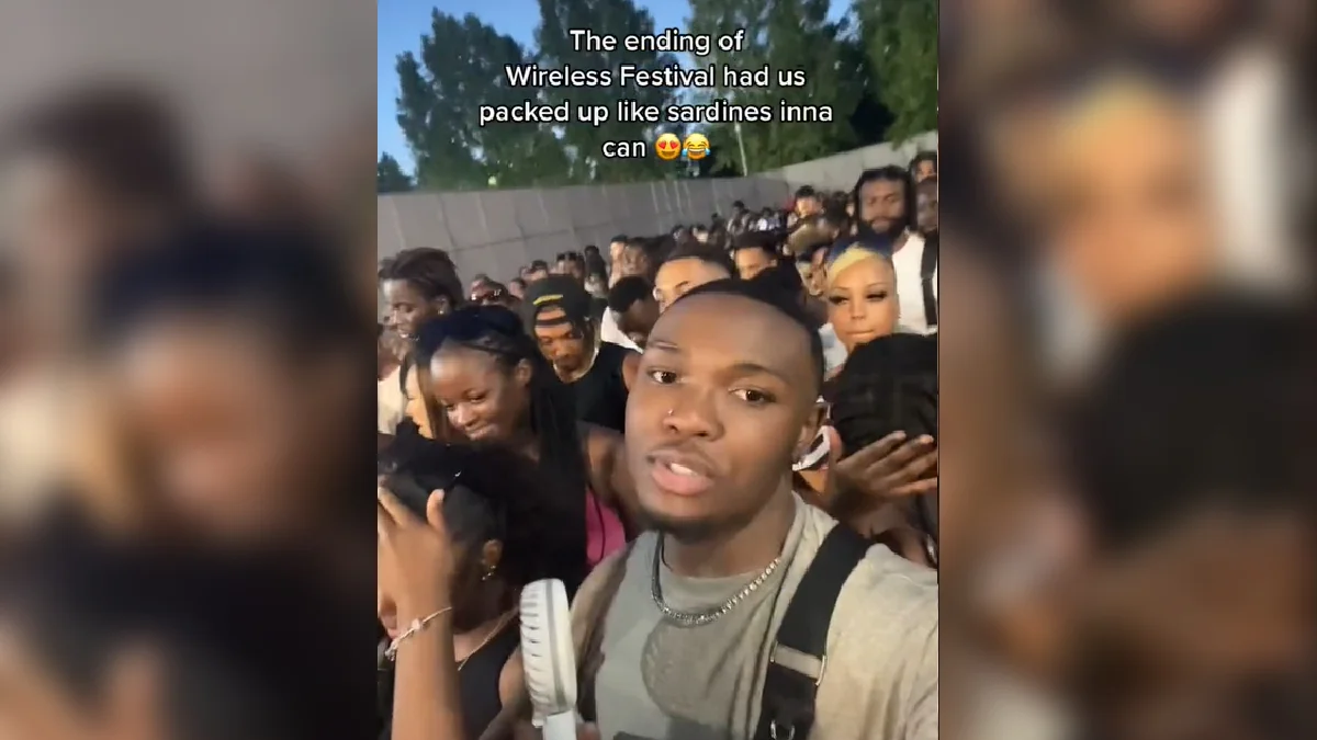 We Cannot Escape We Cannot Come Out — Man filming selfie video in densely packed festival crowd with text overlay about Wireless Festival ending