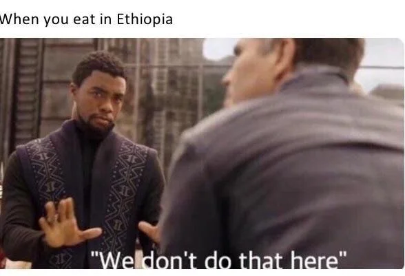Low-resolution T'Challa meme with caption 'When you eat in Ethiopia' and 'We don't do that here.'