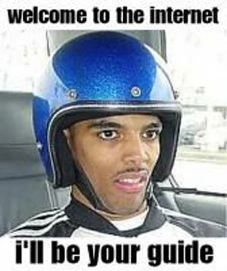 Welcome To The Internet — Young man in oversized motorcycle helmet.