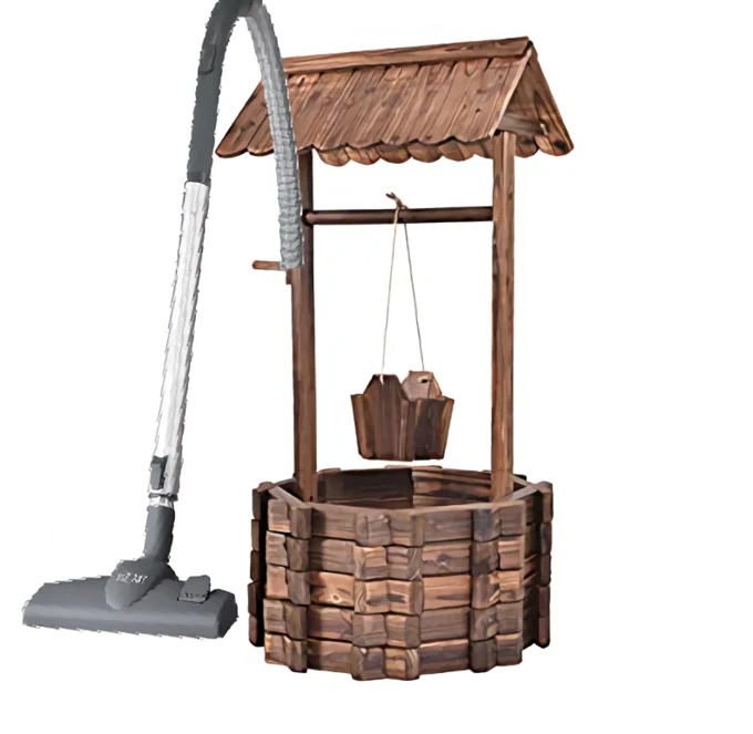 Well That Sucks — Wooden wishing well beside a grey canister vacuum cleaner on white background