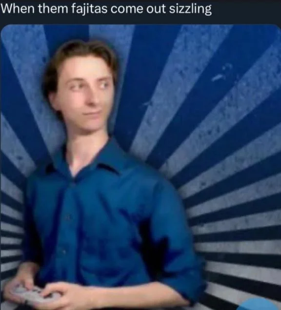 When The Fajitas Come Out Sizzling — Jacksfilms celebrating with fist pump over steaming sizzling fajitas at restaurant