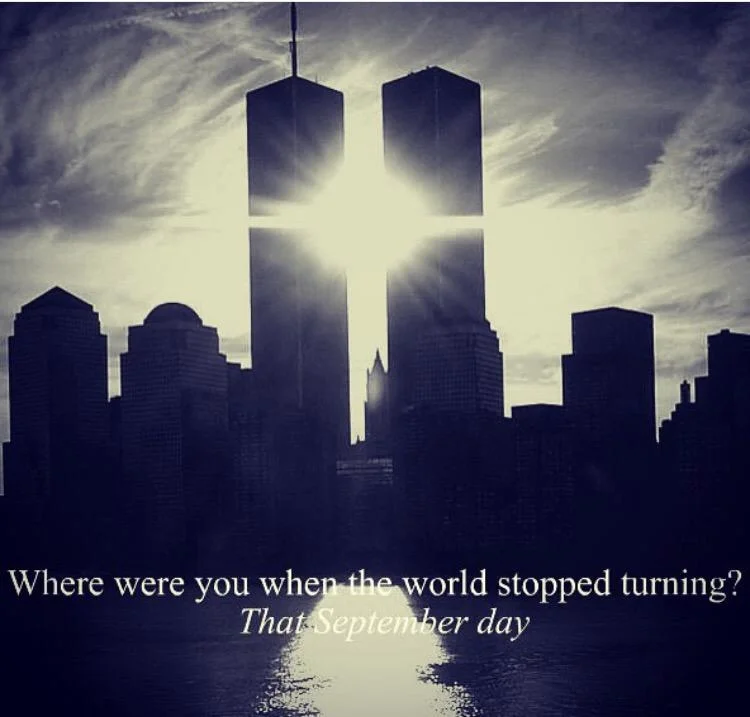 Silhouette of the Twin Towers with sunburst between them and text 'Where were you when the world stopped turning? That September day'
