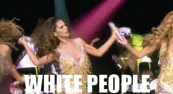 White People Dancing Lol White People — Concert stage scene showing a female pop performer dancing with backup dancers under dramatic lighting with 'WHITE