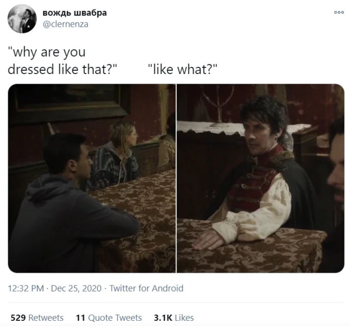 Why Are You Dressed Like That Family Dinner — Twitter screenshot pairing a modern man at a table with a man in period Renaissance dress at a similar table.