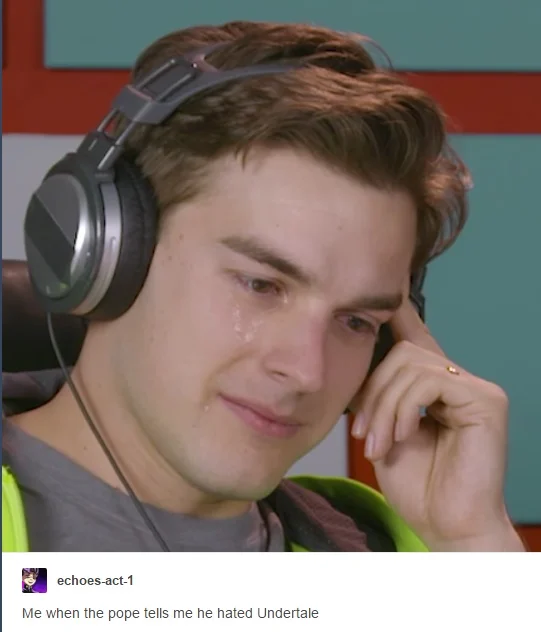 "Why I Gave The Pope Undertale" — MatPat crying with headphones on captioned 'me when the pope tells me he hated Undertale'