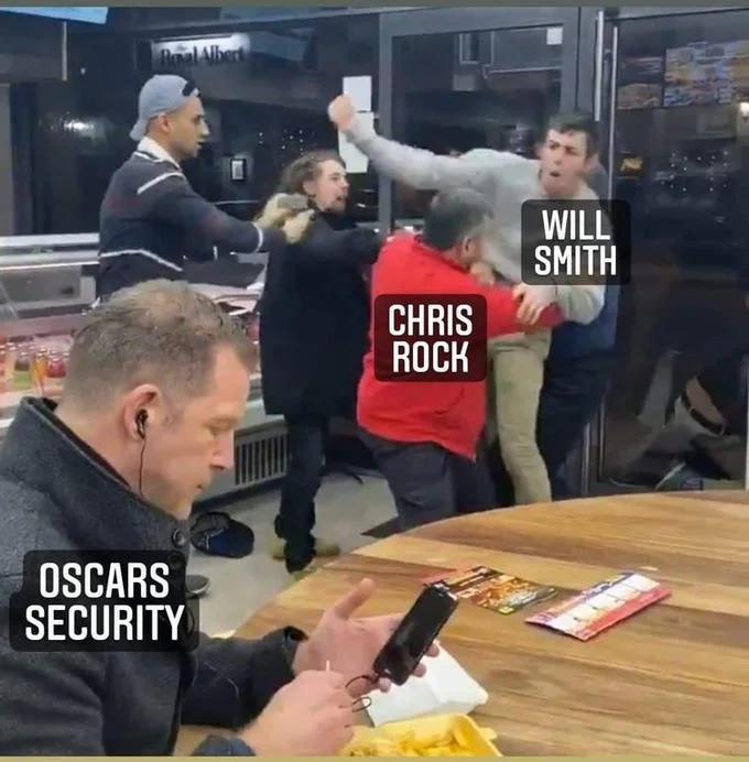 Will Smith Slap — Unaltered photograph from 2022 Academy Awards showing Will Smith mid-slap against Chris Rock on stage.