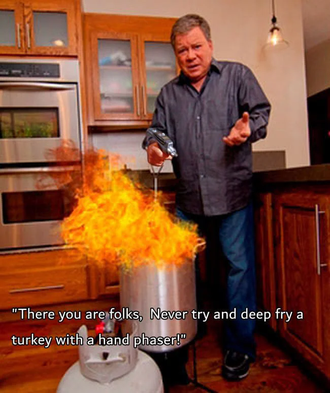 William Shatner in kitchen with burning deep fryer and hand phaser caption