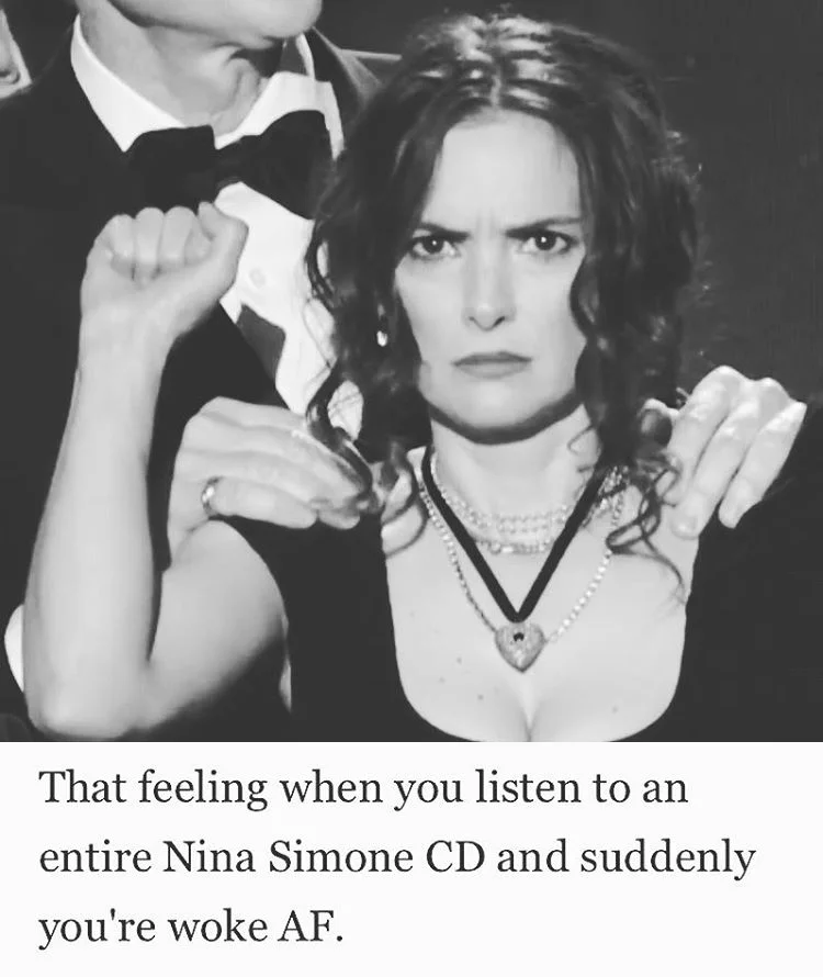 Winona Ryder's SAG Award Reaction — Black-and-white meme of Winona Ryder with a serious face captioned about becoming 'woke' from listening to Nina Simone.