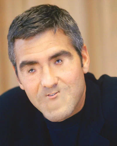 Woll Smoth — Portrait of George Clooney in a dark jacket looking sideways
