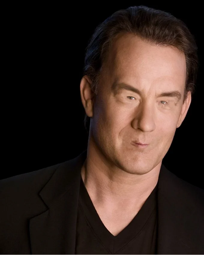 Woll Smoth — Portrait of Tom Hanks in a black suit against a black background