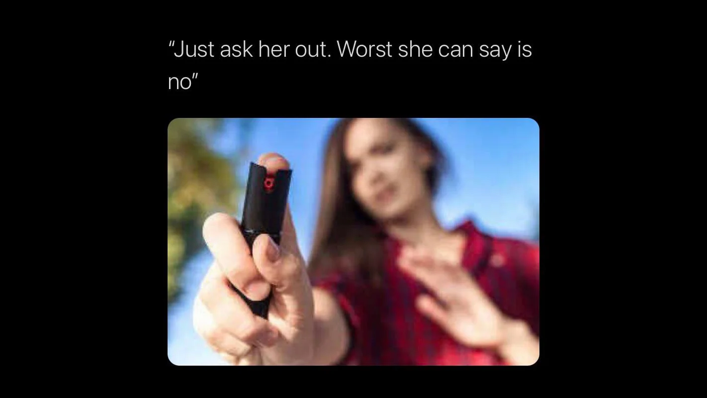 Meme with text 'Just ask her out. Worst she can say is no' above image of woman holding pepper spray