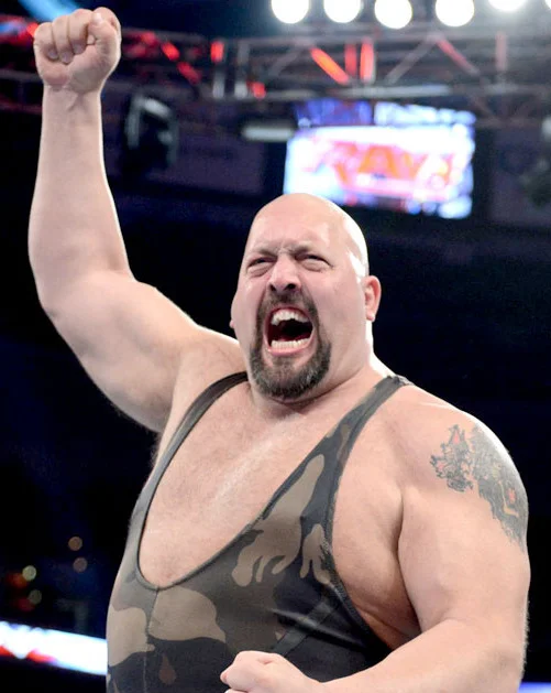 Wrestlemania — WWE wrestler Big Show raising his fist and shouting in the ring wearing a camouflage singlet