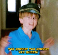Yaass — Young person in blue shirt with outstretched arms and 'YAS QUEEN! YAS QUEEN!' text overlay.