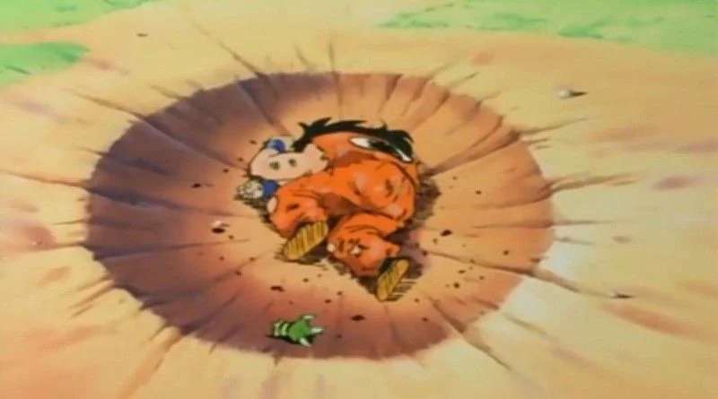 Yamcha's Death Pose — Anime character Yamcha lying dead in a circular crater wearing orange gi
