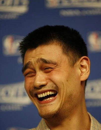 Yao Ming Face — Yao Ming laughing with squinted eyes at NBA press event