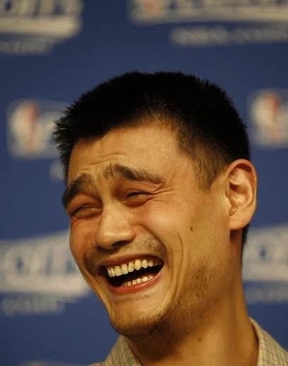 Yao Ming Face — Photograph of Yao Ming laughing with eyes squinted at an NBA press conference