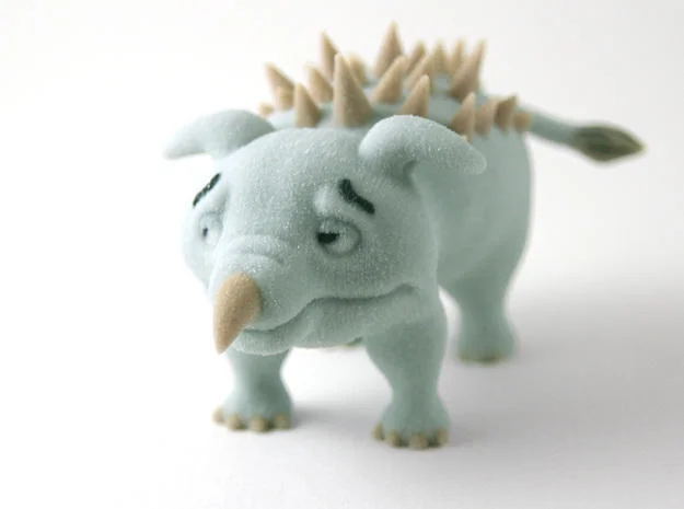3D-printed figurine of the gray spike-backed dinosaur from the Yee cartoon
