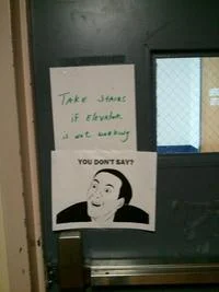You Dont Say  3 — Photograph of printed meme poster on wall with Nicolas Cage reaction.