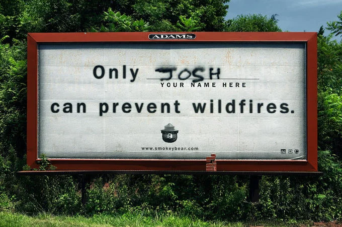 You Had One Job — Vandalized Smokey Bear wildfire prevention billboard reading 'Only Josh can prevent wildfires.'