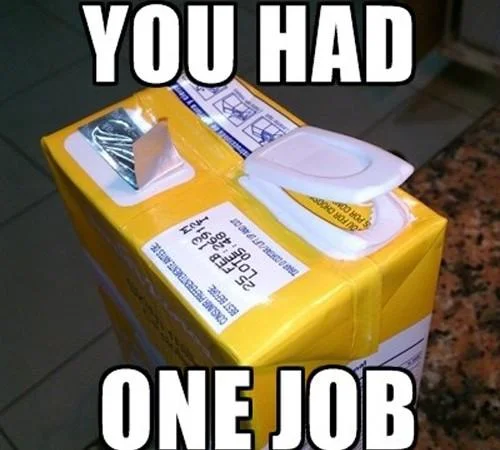 Shipping box with a toilet seat taped to the outside instead of inside, captioned 'you had one job'.