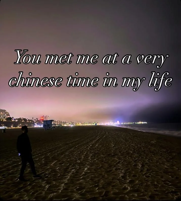 Night beach with silhouetted figure walking and italic text 'You met me at a very chinese time in my life'.