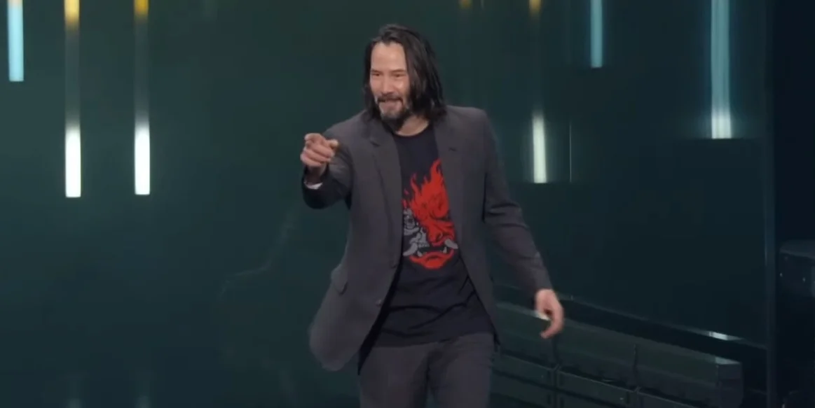 You're Breathtaking — Keanu Reeves on E3 2019 stage pointing at the crowd in a Cyberpunk 2077 shirt