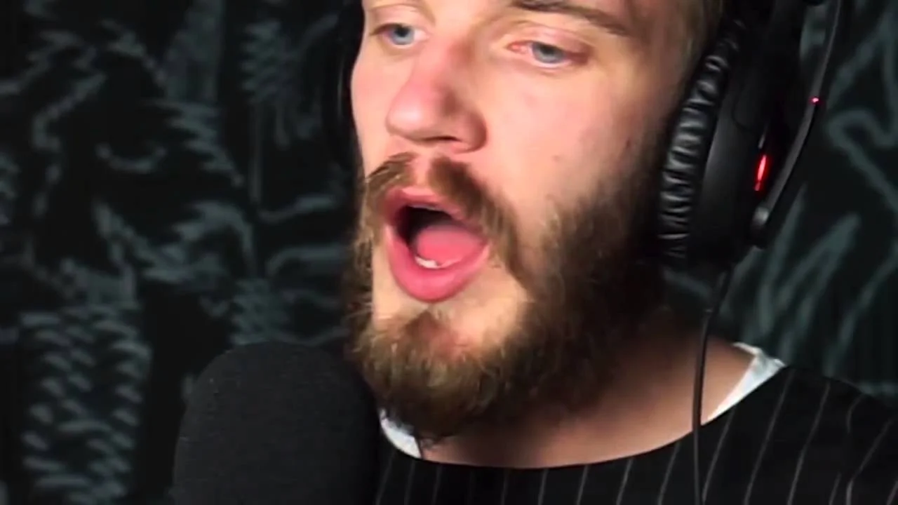 Zero Deaths — PewDiePie wearing headphones speaking into a microphone during a video