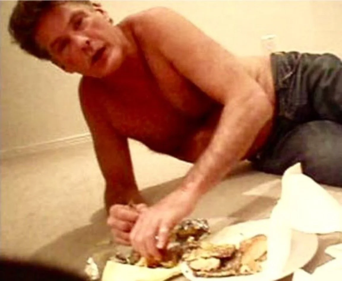 David Hasselhoff Drunk — David Hasselhoff eating a hamburger on the floor while shirtless and intoxicated